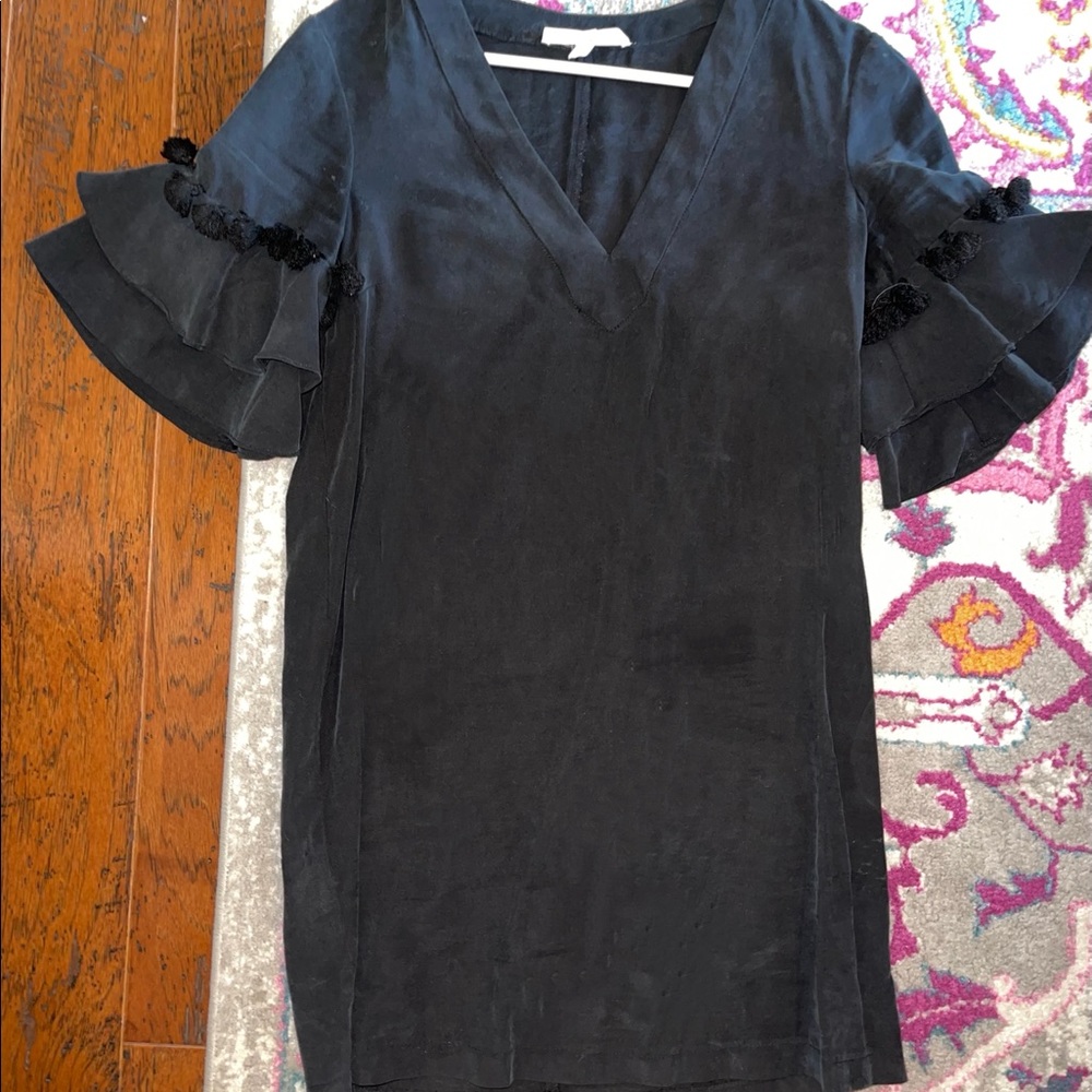 Suede dress with ruffle fringe sleeves.